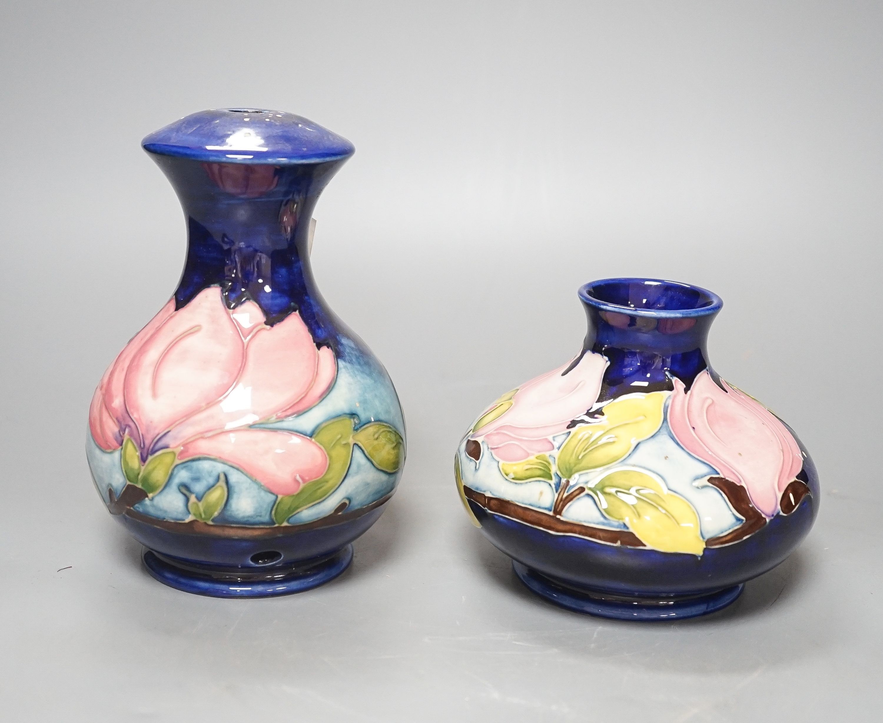Two Moorcroft magnolia pattern vases 17cm